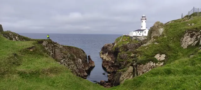 a lighthouse on a cliff