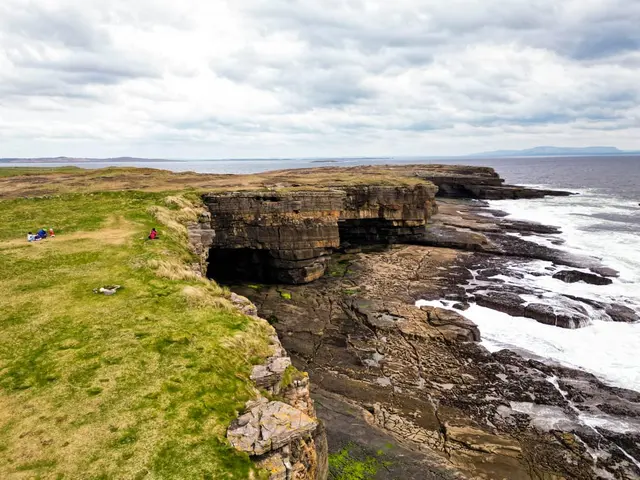 a cliff with a cave in it