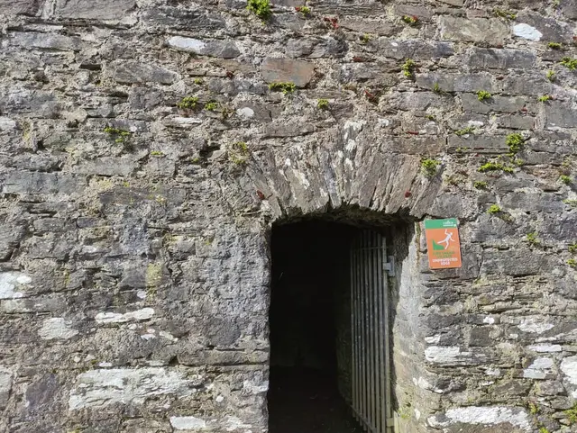a stone building with a door