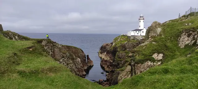 a lighthouse on a cliff