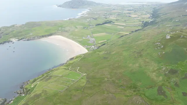 a body of water with land around it