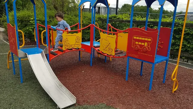 a child playing on a playground