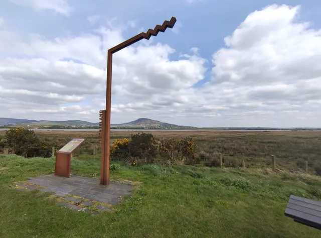 a sculpture in a field