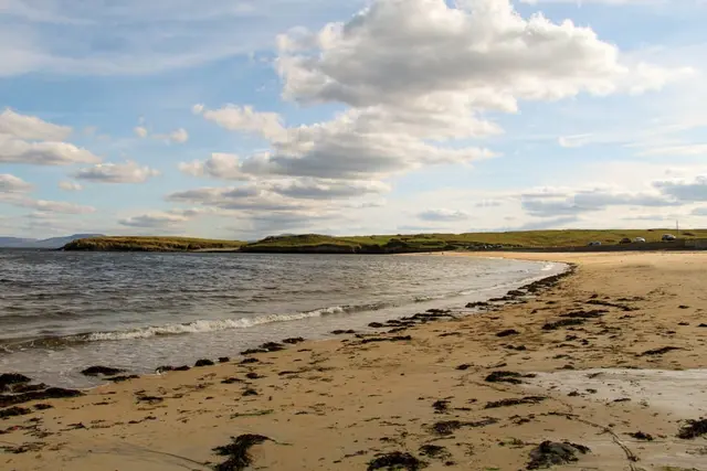 a beach with a body of water